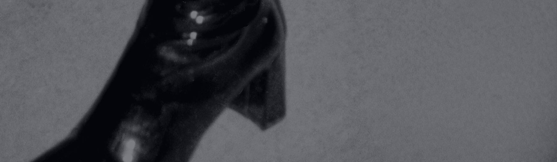 Patent leather heeled boot, black-and-white editorial still